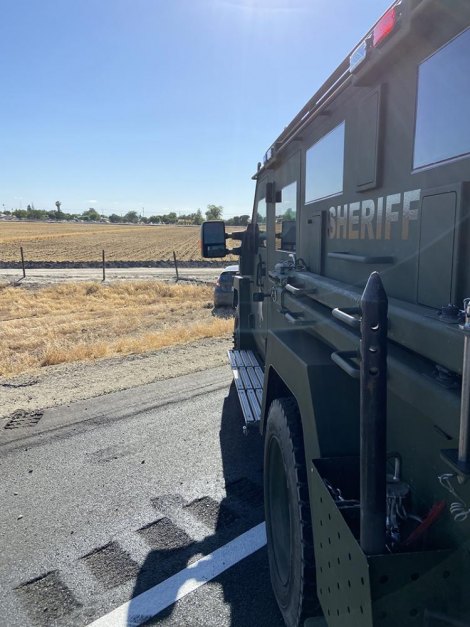 Law enforcement agencies from Tulare, Kings, Hanford, CHP in chase and tense standoff A Kings County Sheriff's vehicle on the scene.